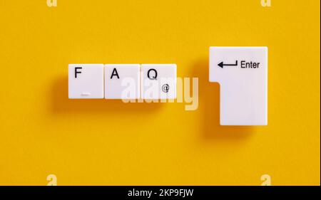 Frequently asked questions, instructions, support, help or assistance on online internet sites. Computer keyboard keys with the word FAQ. Stock Photo