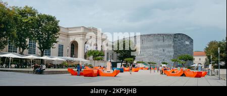 Vienna, Austria - August 28, 2022: Panoramic of the Museumsplatz square in Vienna, Austria, highlighting the modern building of the Mumok - Museum Mod Stock Photo
