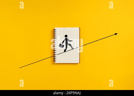 Personal ambition, vision and advancement in business career concept. Employee symbol walking the upwards line. Stock Photo