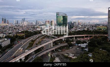 Aerial view of 'Taman Anggrek' the biggest shopping mall and apartment in Jakarta when sunrise. Jakarta, Indonesia, November 28, 2022 Stock Photo