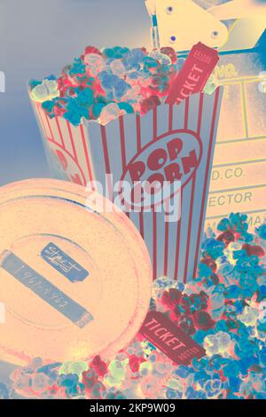 Creative pop art still on a movie production scene of film reels and popcorn cinema. Retro flicks Stock Photo