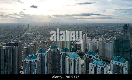 Aerial view of 'Taman Anggrek' the biggest shopping mall and apartment in Jakarta when sunrise. Jakarta, Indonesia, November 28, 2022 Stock Photo