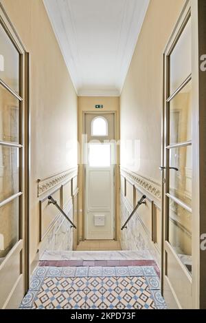 Entrance door and Marble stairs in renovated mansion stairwell Stock Photo