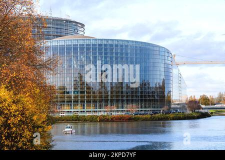 Strasbourg, France - Nov 22, 2022: Police boat in front of 70 years of European democracy in action large banner on facade of parliament during ceremony marking the 70th anniversary of the European Parliament Stock Photo