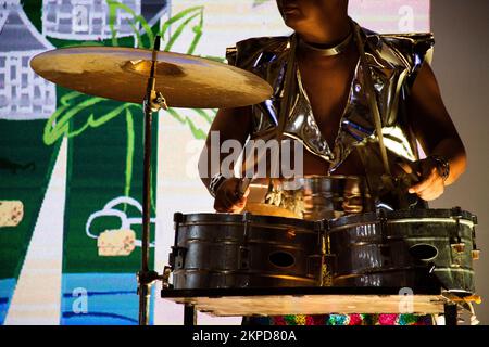 Music band and thai men actor or musician playing classic instrument drum set snare and dancing to beat with lighting color sound for show visitor gue Stock Photo