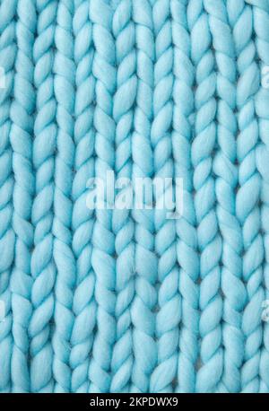 Close up above view of light blue soft wool knitted wool background. Stock Photo