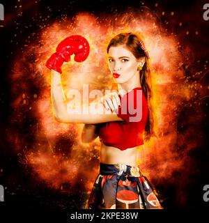 Strong resilient and determined pin up boxing girl flexing arms in a WE CAN DO IT concept. Box on peoples Stock Photo