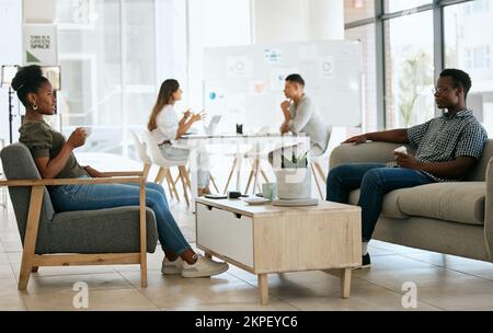 Business people, interview and recruitment with hr, waiting and talking in office for job seeker and employment company. Black man and woman talking Stock Photo