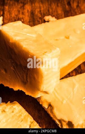 Chunks of old parmesan cheese close-up. Vintage Italian cheeses Stock Photo