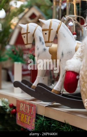 Close-up view of the wooden rocking horses decoration selling at the Christmas market. Stock Photo