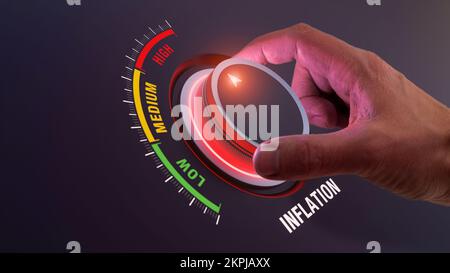 High inflation rate and economic crisis, increasing prices of goods and services, decreasing purchasing power. Person holding red knob button. Finance Stock Photo