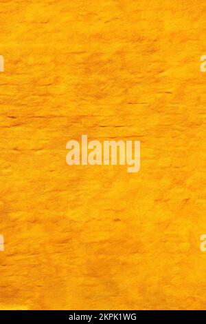 Yellow brick wall facade as background. Old building exterior wall surface from Halmstad in Sweden. Stock Photo
