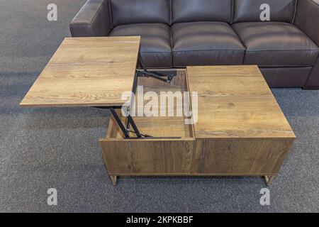 Lift Up Coffee Table Space Saving Furniture in Modern Living Room Stock Photo