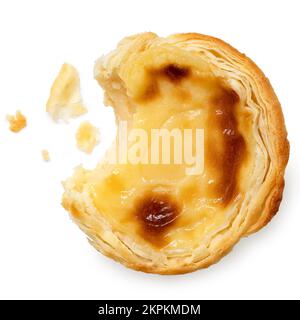 Partially eaten portuguese custard egg tart with crumbs isolated on white. Top view. Stock Photo