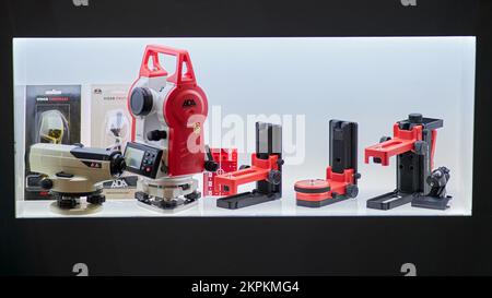 Measuring geodetic instrument for engineering works and topographic survey. Exhibition of professional tools for work, repair and construction Mitex - Stock Photo