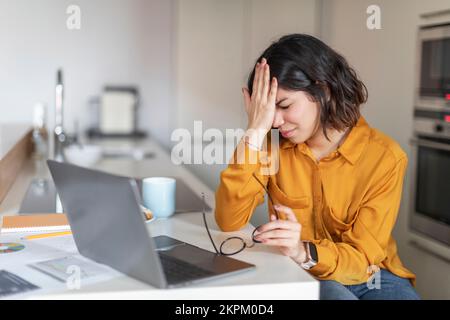 Failure Concept. Arab Woman Having Stress While Working With Laptop At Home Stock Photo