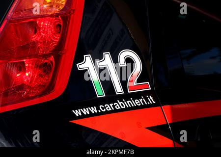 Carabinieri car with the emergency number 112 in the foreground and in the  background the police station of Monopoli (Puglia-Italy Stock Photo - Alamy