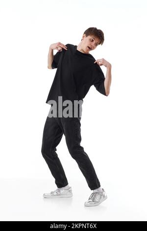 young man in black t-shirt and jeans dancing Stock Photo