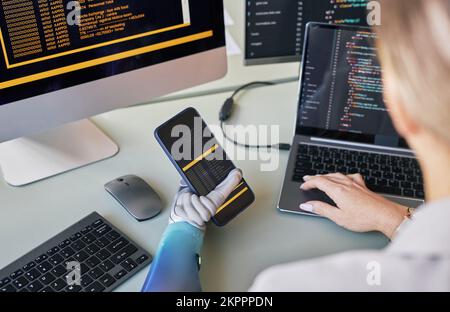 Female scientist working on mobile application for people with bionic arms Stock Photo