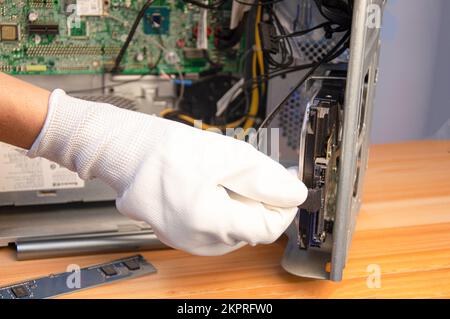 side view technician repairing computer Stock Photo