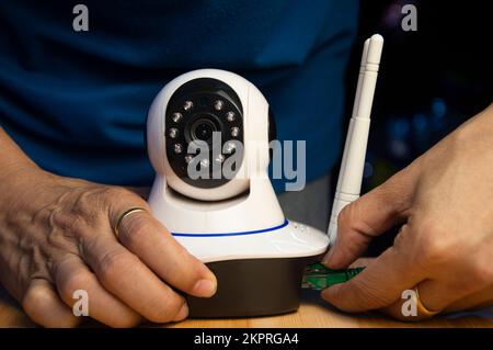 Conceptual man operating ip camera Stock Photo