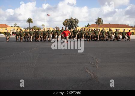 New U.S. Marines with Delta Company, 1st Recruit Training Battalion, exercise during a motivational run at Marine Corps Recruit Depot (MCRD) San Diego, Nov. 3, 2022. The motivational run was the last physical training Marines conducted while at MCRD. Stock Photo