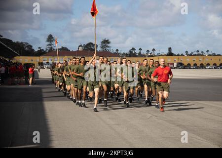 New U.S. Marines with Delta Company, 1st Recruit Training Battalion, run in formation during a motivational run at Marine Corps Recruit Depot (MCRD) San Diego, Nov. 3, 2022. The motivational run was the last physical training Marines conducted while at MCRD. Stock Photo