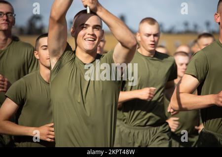 New U.S. Marines with Delta Company, 1st Recruit Training Battalion, run in formation during a motivational run at Marine Corps Recruit Depot (MCRD) San Diego, Nov. 3, 2022. The motivational run was the last physical training Marines conducted while at MCRD. Stock Photo