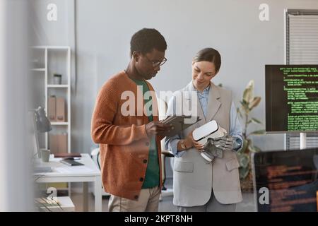 Team of developers testing new application for VR headset Stock Photo