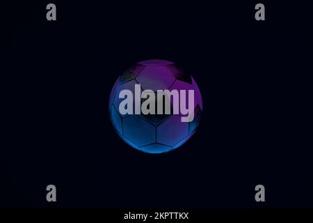 neon soccer ball over dark background, 3d render Stock Photo