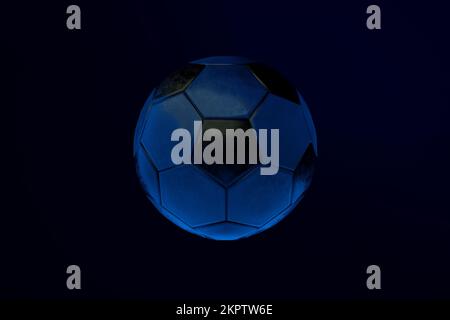 Soccer ball over dark background, 3d render Stock Photo