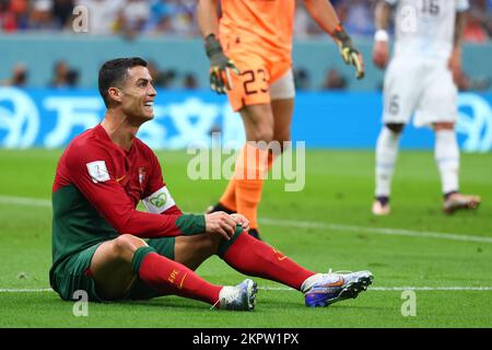 Lusail, Qatar. 28th Nov, 2022. Soccer, World Cup 2022 in Qatar, Portugal - Uruguay, Preliminary Round, Group H, Matchday 2, Lusail Stadium, Portugal's Cristiano Ronaldo sits on the turf after missing a chance. Credit: Tom Weller/dpa/Alamy Live News Stock Photo