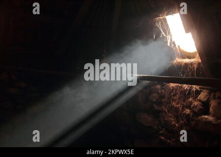 Sunlight beam enters an old hay barn Stock Photo