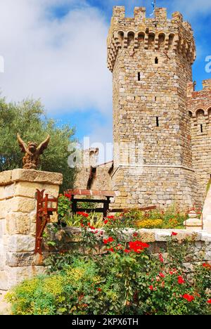 Flowers grow at the entrance of a recreated Medieval castle in California that is now a winery in a vineyard in the Napa Valley Stock Photo