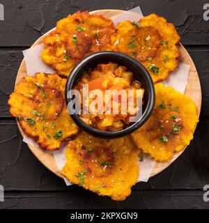 Patacon or toston, fried and flattened pieces of green plantain Stock Photo