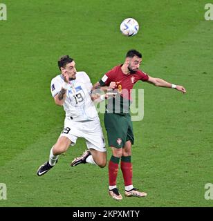 Lusail, Qatar. 28th Nov, 2022. Sebastian Coates (L) of Uruguay vies with Bruno Fernandes of Portugal during the Group H match between Portugal and Uruguay at the 2022 FIFA World Cup at Lusail Stadium in Lusail, Qatar, Nov. 28, 2022. Credit: Xin Yuewei/Xinhua/Alamy Live News Stock Photo