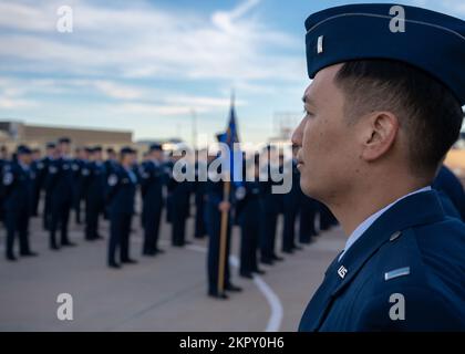 Open Ranks Inspection Guide Members of the 162nd Logistics Readiness Squadron wait in formation ...