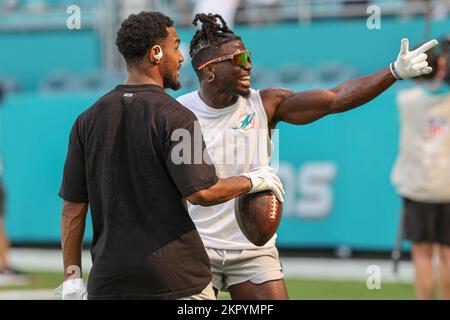 Miami Dolphins wide receivers Jaylen Waddle (17) and Tyreek Hill (10) walk  off the field during the second half of an NFL football game against the  New England Patriots, Sunday, Sept. 11