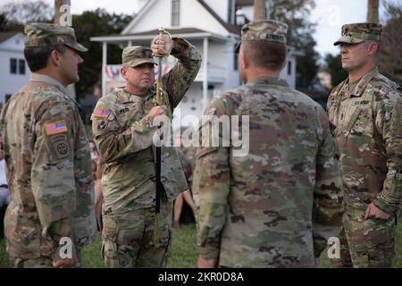 Command Sgt. Maj. Jasen Pask, incoming state command sergeant major, braces Noncommissioned Officers’ Sword during a change of responsibility ceremony held in St. Augustine, Fla., on November 5th, 2022. The Noncommissioned Officers’ Sword was established as a combat weapon in 1840, but today is used to signify the transition of an organization’s outgoing and incoming senior enlisted leaders. Stock Photo