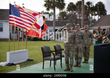 Maj. Gen. John Haas, the commander of the Florida Army National Guard (left), salutes with Command Sgt. Maj. Brian Kendrick, outgoing state command sergeant major (center), and Command Sgt. Maj. Jasen Pask, incoming state command sergeant major (right) during a change of responsibility ceremony held in St. Augustine, Fla., on November 5th, 2022. Stock Photo