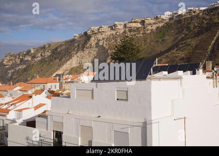 Solar energy panels installed on the roof of a resdiential building in Nazare, Portugal. Stock Photo