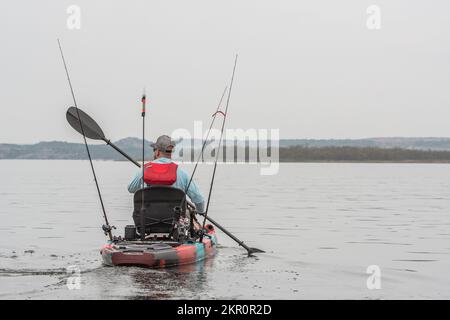 Man Kayak Fishing on a Lake in Texas Stock Photo