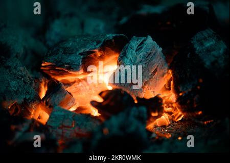 Detailed plan of the combustion chamber in the fireplace, burning wood in the fireplace, the process of burning wood. Stock Photo