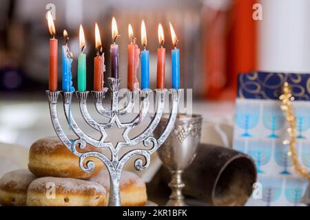 Hanukkah celebration Judaism tradition family religious holiday symbols lighting hanukkiah menorah candles Stock Photo