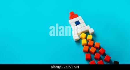 Startup rocket from blocks in launch. Concept of a successful start of a business project. Entrepreneurship. Investments in the development of high-te Stock Photo