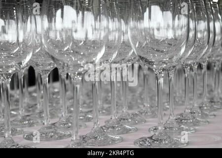 pile of empty wine glasses on table Stock Photo