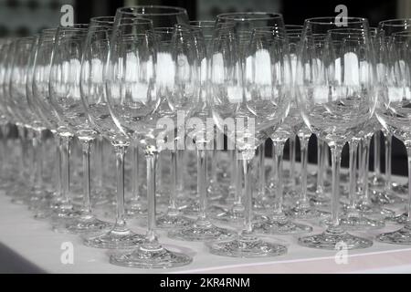 pile of empty wine glasses on table Stock Photo