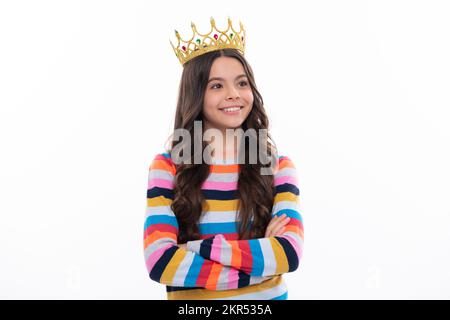 Girls party, funny kid in crown. Child queen wear diadem tiara. Cute little princess portrait. Happy girl face, positive and smiling emotions. Stock Photo