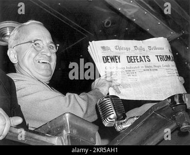 President Harry S. Truman at St. Louis' Union Station holds up an election day edition of the Chicago Daily Tribune, which - based on early results - mistakenly announced 'Dewey Defeats Truman.' Stock Photo