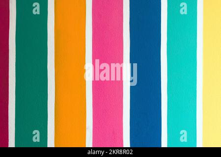 Multicolor vertical striped pattern on cement wall. Colorful painted on cement surface of the wall. Graffiti in the colors of rainbow. Colour full of Stock Photo